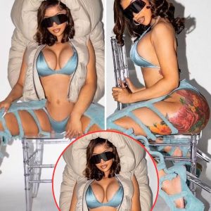 Cardi B puts on a very busty display in an icy blue bikini and matching thigh-high boots during a sultry photo shoot -News